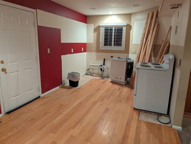 Kitchen with dated 2010-era finishes before renovation