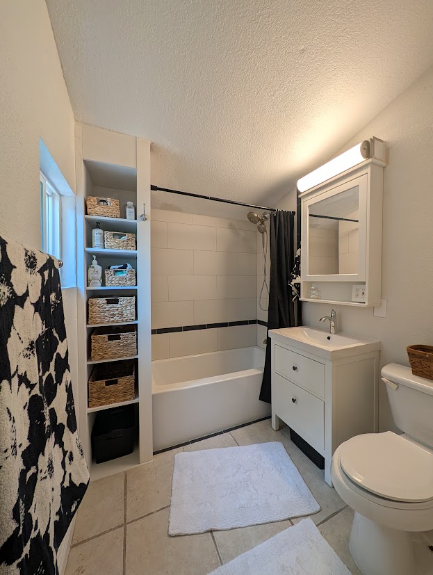 Renovated 1913 bathroom with new medicine cabinet and shelving